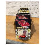 Assorted NASCAR stock cars with card and stand