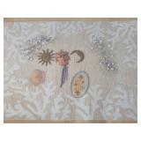 Collection of sun and moon faces with rug