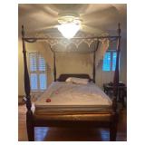 traditional four-poster canopy bed