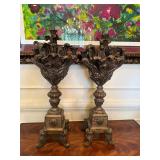 Pair of Tuscan-style carved wood pedestal candle h