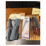Knife in wooden block, pizza chopper, hand towel