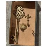 Small brass hooks and decorative skeleton key