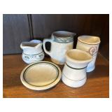 Ironstone creamers and butter pat
