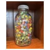 Square mason jar full of marbles