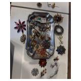 Tray full of brooches