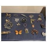 20 brooches