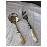 2 mother of Pearl utensils sterling silver bands