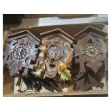 Three cuckoo clocks all need repair