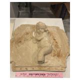 Heavy chaulk wall hanging of cherub