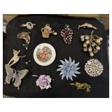 13 brooches