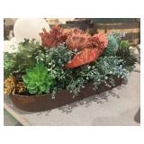 Vintage elongated cast-iron pan with fake flowers