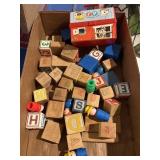 Wooden blocks and Fisher-Price toys