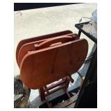 Three wooden TV trays with holder