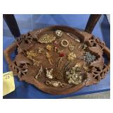 Carved wood tray with 23 brooches