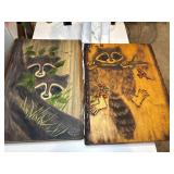 Two large handpainted raccoon plaques