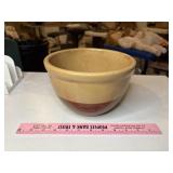 Brown and cream pottery bowl small chip