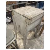 Primitive wooden box on legs, possibly clothes,