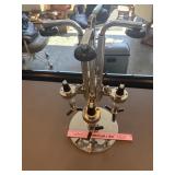 Chrome plated four bottle liquor dispenser