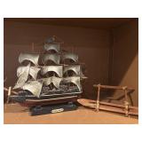 Cutty Sark ship and wooden canoe
