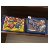 Two vintage die cast, mini cars cases