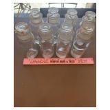 8 vintage TCW Co. apothecary bottles with