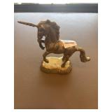 Heavy brass unicorn on base