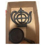 Small cast-iron pan and tea pot shape trivet