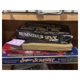 Four games rummikub, super Scrabble, Scrabble