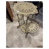 Antique three tiered, cast-iron, ornate table
