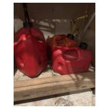 Three plastic gas cans, 2 one gallon and one  2