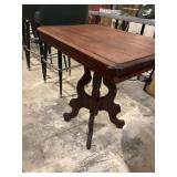 Antique wooden accent table with pedestal base