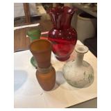 Four vases, red, green, amber, white