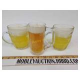 Three glass beer candles