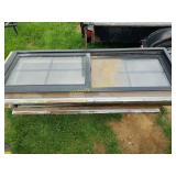 Three exterior windows with screens