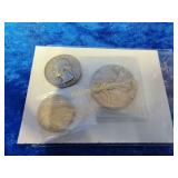 Two silver coins and a v nickel