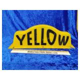 Yellow cab topper has some damage