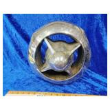 Front of a Studebaker heavy chrome emblem