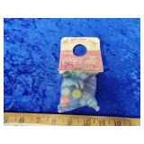 Coca-Cola Marbles goes around the bottle