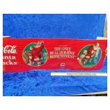 Coca-Cola Santa packs banner