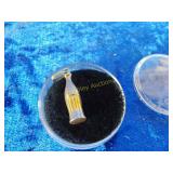 Possibly gold necklace charm Coca-Cola can