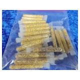 25 vials of gold flakes