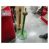 Green and brass Coca-Cola stand very heavy