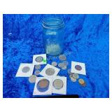 Antique ball jar with foreign coins