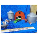 Tote full of farming toys barns,grain bins and