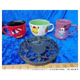 Three coffee cups Mickey mouse and a heavy metal