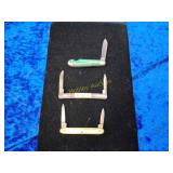 Three vintage carnival knives