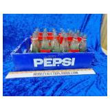 Pepsi plastic crate with Coca-Cola bottles