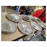 9 vintage hubcaps