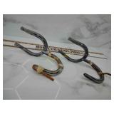 Horseshoe gun rack holder