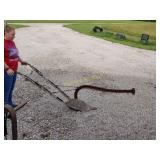 Horse-drawn plow bring help to load